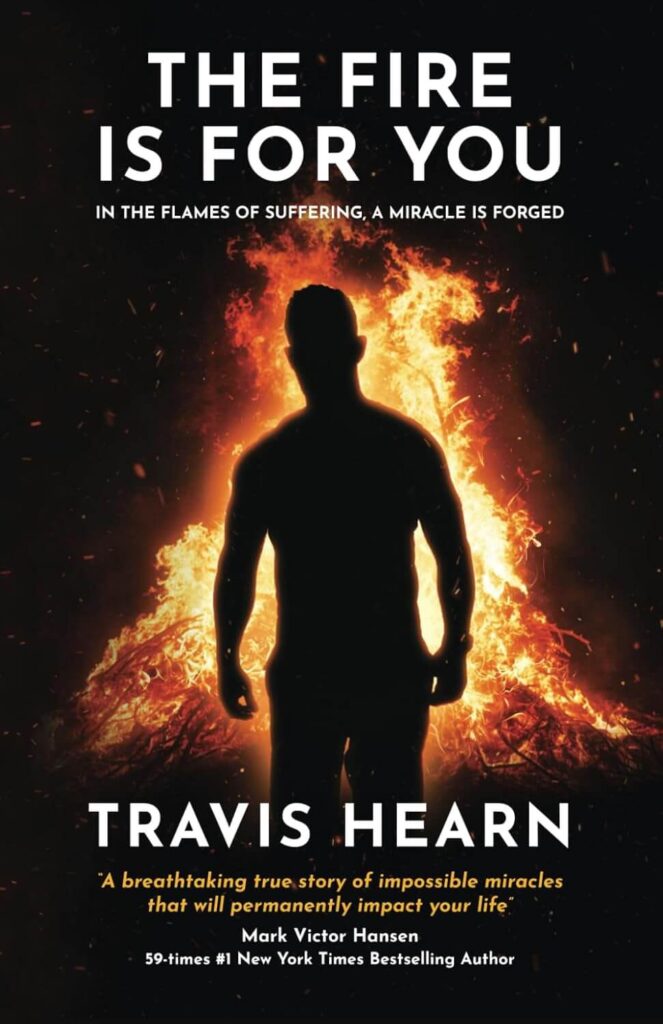 a poster of a man standing in front of a fire
